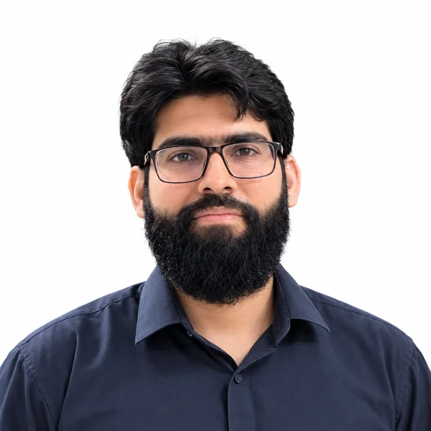 Ahmad Nasrullah in a navy shirt and glasses